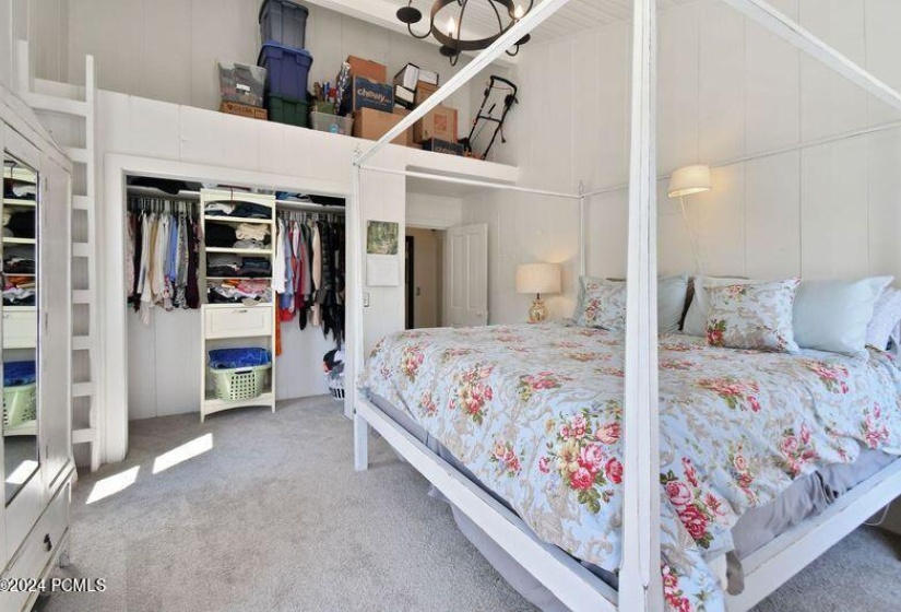 Primary bedroom with loft storage