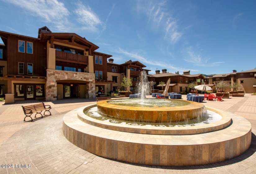 common area plaza fountain summer scene